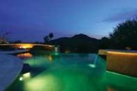 The Canvas:Arid landscape, a hillside terrain, a postcard-perfect mountain viewThe Palette: Winding gunite aqueducts, golden travertine marble, a desert oasis encircled in cool watersThe Masterpiece:A classic Old World idea, a New Millennium look, a timeless creation