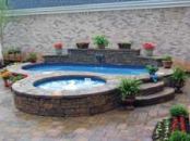 THE CANVAS:Small courtyard, narrow slice of suburbia, Spartan landscapeTHE PALETTE:Bronze antique pavers, Cobalt ceramic tiles, faux pebble fiberglass shellTHE MASTERPIECE: Private retreat, cozy center for spiritual renewal, tranquil sound of moving water