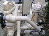 Correct layout: Chemical feeders

(above) and salt chlorine generators (below) must be placed

downstream of heaters to prevent freshly chlorinated water from

damaging the heating elements. A chemical-resistant check valve

installed between the heater and sanitizing system also protects

the heater.