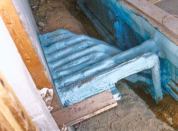 Circulating efficiency: Insulating the pipes helps retain heat and can protect the plumbing from wear. Here, a spray-on material is used.