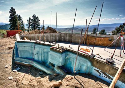 Circulating efficiency: Insulating the pipes helps retain heat and can protect the plumbing from wear. Here, a spray-on material is used.