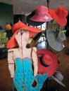 A unique wooden mermaid

adorned with accessories by San Diego Hat Co. greets customers as

they approach the checkout counter