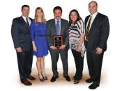 The Sanchez clan: Proudly

displaying a recent award are, l-r, Edgar Sanchez, COO; his wife

Julie; Cesareo Sanchez, president; Karla (Sanchez) Escobar,

director human resources; Al Escobar, sales/marketing

manager.