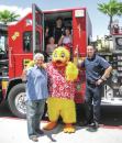 Joe Vassallo, Paragon Pools’ president, and Duckie, the Float Like A Duck mascot, invite families to join them for the 10th Annual Paragon Pools water safety event.