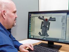 Intelligent design: Tim Clemens, SwimWays’ manager of industrial design, shows how he developed Submorphers, a line of shape-shifting pool toys. He used a CAD program called “Solidworks” to design the product, which was awarded Outdoor Play “Toy of the Year” by Creative Child Magazine.