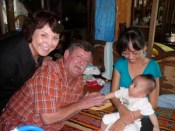 Penny and Tommy Johnson visiting the family of some of their students.