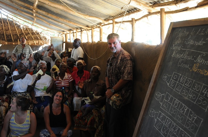 Skip Phillips, far right, celebrating a service in a Mozambican village.
