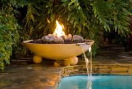 A fire element can add a spark of drama to a poolscape.