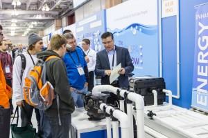 Steve Barnes, chairman of the APSP Technical Committee and director of science and compliance at AquaStar Pool Products in San Diego, explains The Wall — Water in Motion exhibit.