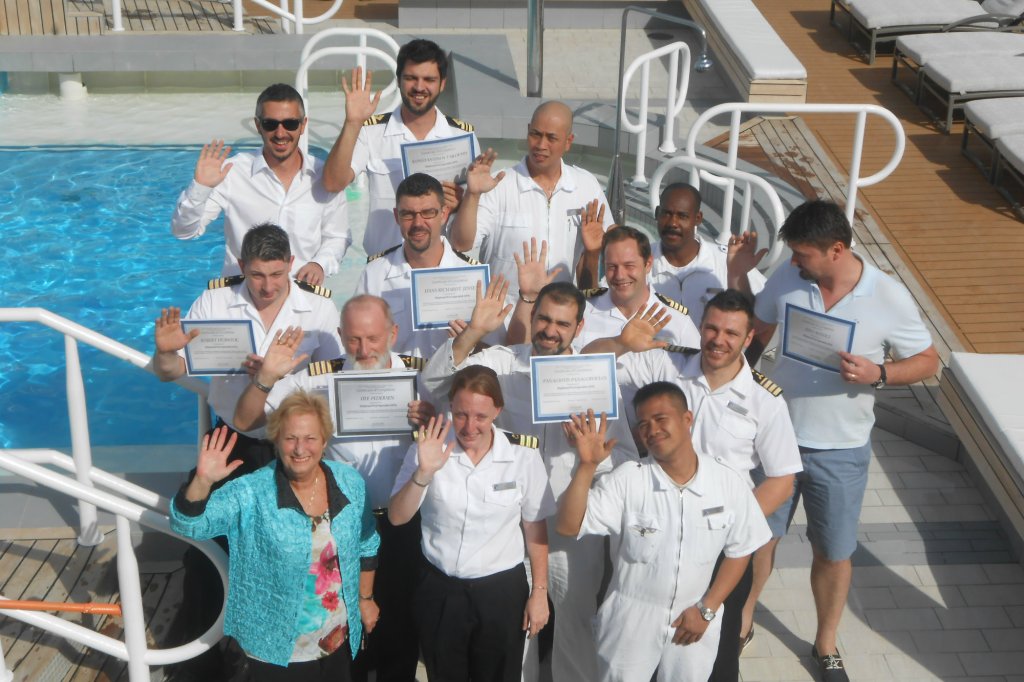 Graduates of a CPO course taught by Connie Sue Centrella (front, far left) gather on the deck of the Azamara Quest in the Greek islands. (photo courtesy C.S. Centrella)