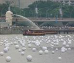 Wishing spheres bob on Singapore's Marina Bay.