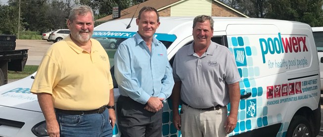 Pleasant Pools and Spas' Howard Fleming, left, and Tedd Fleming, right pose with Darrell Doust, chief operating officer of Poolwerx USA.