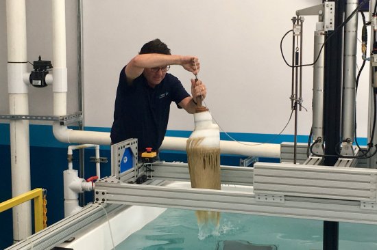 AquaStar Pool Products’ director of science and compliance, Steve Barnes, uses the apparatus for testing drain covers for hair-entanglement hazards.
