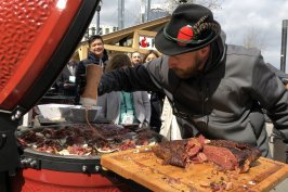 Attendees of the Hearth, Patio & Barbecue Expo in Nashville line up for samples hot off the grill.