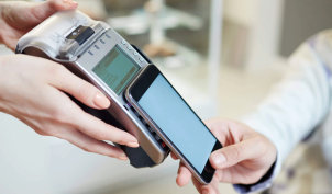 A person paying with a mobile phone