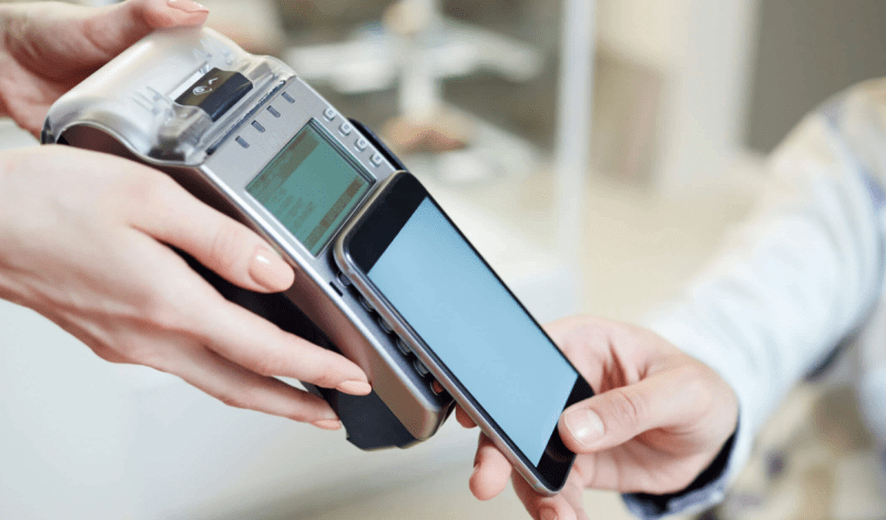 A person paying with a mobile phone