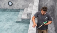 An installer easily welded-in the designer PVC membrane to create the pool’s natural stone-like finish