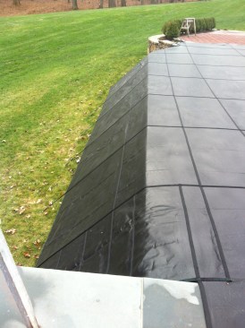 A safety cover extends over a vanishing-edge wall.