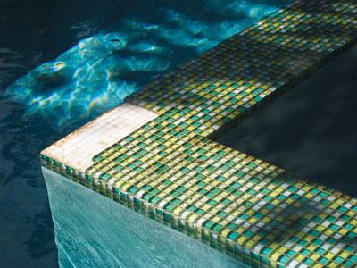 Though mesh-mounted glass mosaic tile is easiest to install, the industry is moving away from its use in pools and spas, considered one of the toughest environments for the material to withstand. On this installation, the tiles came off while the mesh stayed in place. Spillover and vanishing-edge walls, which are subjected to wet-dry/hot-cold conditions, are particularly vulnerable to problems.