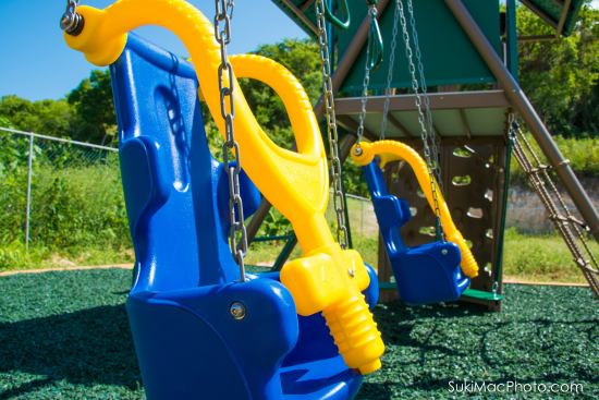 Children of all ages can enjoy the playground thanks to special features like this safety swing.