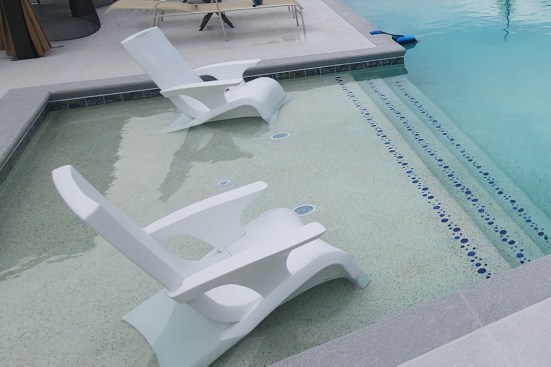 Fifteen-foot sun shelf with bubble designs descends into the pool