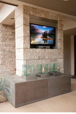 Three individual glass-enclosed flames offer ambiance and provide a balance of modernism while drawing on a natural element to create a serene escape.