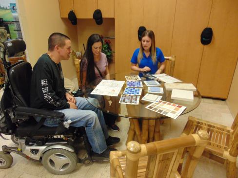 Derek Avilez and his wife select options for his new pool.