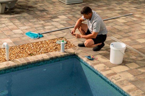 Pool technician reviews a checklist to stay organized and ensure that no tasks are overlooked.