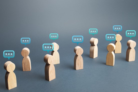 People figures with comment clouds above their heads. Commenting on feedback, participation in discussion. Brainstorming, fresh new ideas. Communication in civil society. Cooperation and Collaboration