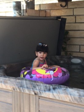 Aubrey enjoys a dip in her new hot tub.