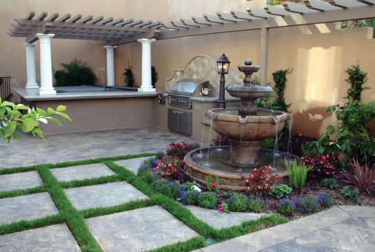  A fountain emits pleasant sounds for bathers.