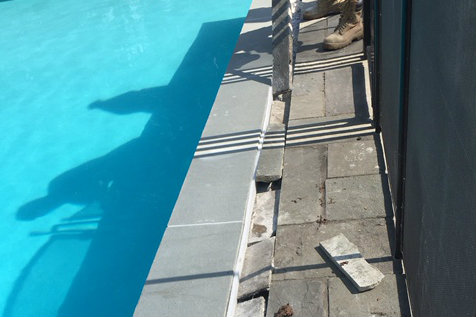 The homeowner alleged the landscape contractor incorrectly cut the bluestone deck and that it proved costly to weave in new bluestone pieces to match and cover the gap created. (photo: Samatha Mendolia)