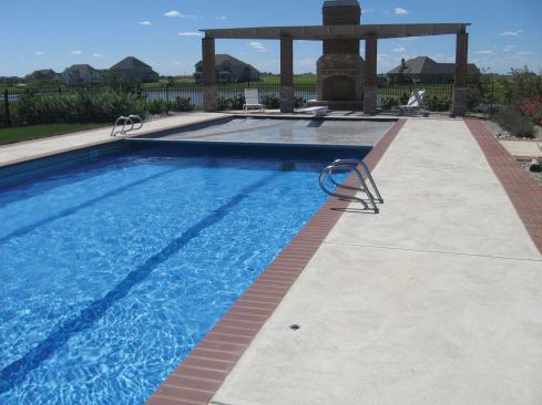 Going to great lengths: This pool was a challenge to cover due to its 75-foot length. Cardinal Pool and Outdoor in Champaign, Ill., says prime considerations included dealing with lots of drag, and ensuring that the cover is heavy-duty in terms of motor, ropes and cover material. Another view of the pool is on the previous page.

