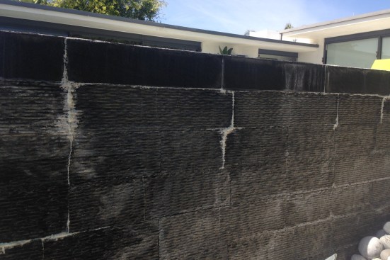 On these stone-tile installations that National Tile and Stone Authority inspected, latex has re-emulsified through the grout, likely due to inadequate curing times for the thinset.