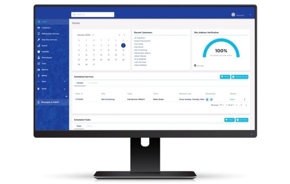 Computer monitor shows pool service software tools.