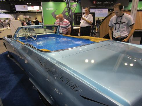 The Carpool DeVille at the Marquis booth attracts onlookers.