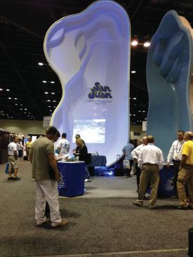 San Juan's fiberglass pools tower above the show floor. 