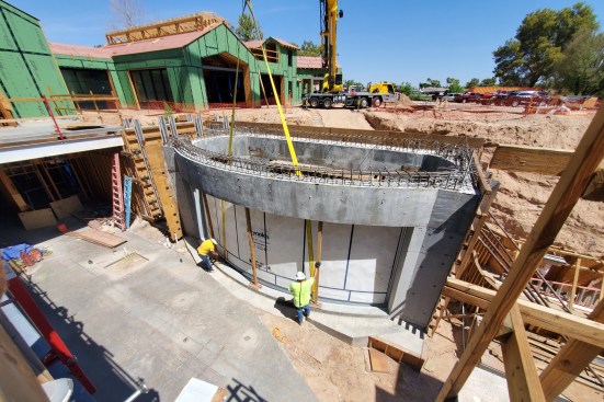 The shark tank is erected before contractors build the basement room in which it will sit. The radiused acrylic panel that provides most of the viewing measures 350 inches wide and 130 inches tall. It had to be ordered well in advance, so the team had to build the structure and rebates precisely to fit the sizable piece.