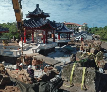 Special specimen: On this project, there was even more pressure than normal to find pieces with unique character. To do this, Duensing visited the quarry multiple times, even veering out into the woods to view the discards. There, he was drawn to one particular rock — a long, narrow specimen that formed an eye-catching arch. Even more special, it was weathered on all sides, rather than cut raw on one end, so it looked great from all angles. Duensing didn’t know what to do with it, so he kept passing it up. “Finally I said, ‘I just have to take it,’” he says. Eventually it occurred to him: the arch-shaped piece could serve as a bridge, in place of the geometric one originally planned. The rock (pictured center) also fulfilled a tradition in Chinese gardening, by which bridges have curves and pathways have turns, requiring the walker to glance down for a moment. This makes them more alert to their surroundings, and when the person looks up after taking a couple of steps, they will see a newly composed view.