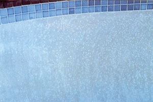 Spotty problem: Spot etching, seen here near the waterline tiling, is a common symptom of water with low calcium hardness, low carbonate alkalinity, low total dissolved solids and/or low pH. In certain cases, it may also be a symptom of poorly mixed plaster or improper plastering practices.