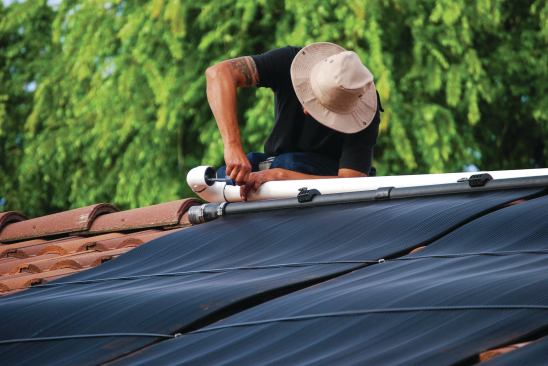 7) Meanwhile, the return line is fitted to the top of the collectors. When the collectors are operating, water from the pool will come into the collectors from the bottom and be heated as it rises through. It will then be returned to the pool.