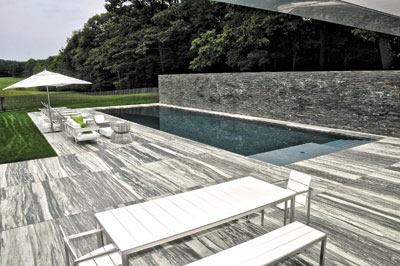 Fine

lines: This sleek project by Drakeley Swimming Pool Co. in

Bethlehem, Conn., took home gold for Outstanding Achievement in

Design and Building, Concrete. The third-generation of pool

builders also received a bronze in the Perimeter Overflow

(Wet-Edge) Pools category.