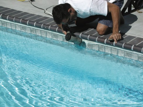 2. Carefully use a blow dryer on the liner section affected by the smiley, to heat up the vinyl and make it more pliable. If it’s a warm day, this step may not be necessary. 