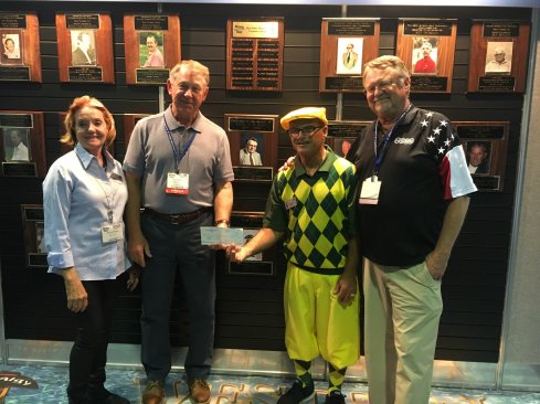 Ceremony to honor Don Wilson in front of the WPSS Honor Wall. Pictured from left to right: Gloria Wilson, wife of Don Wilson, John Norwood president of CPSA, Glen Knecht, current president of the Western Show board, and Mark Wilson CEO of HASA and son of Don Wilson. Also presenting the honor, but not pictured, are Leslie Tone, Lynn Cummings, and Lisa Johnson, children of Don Wilson.